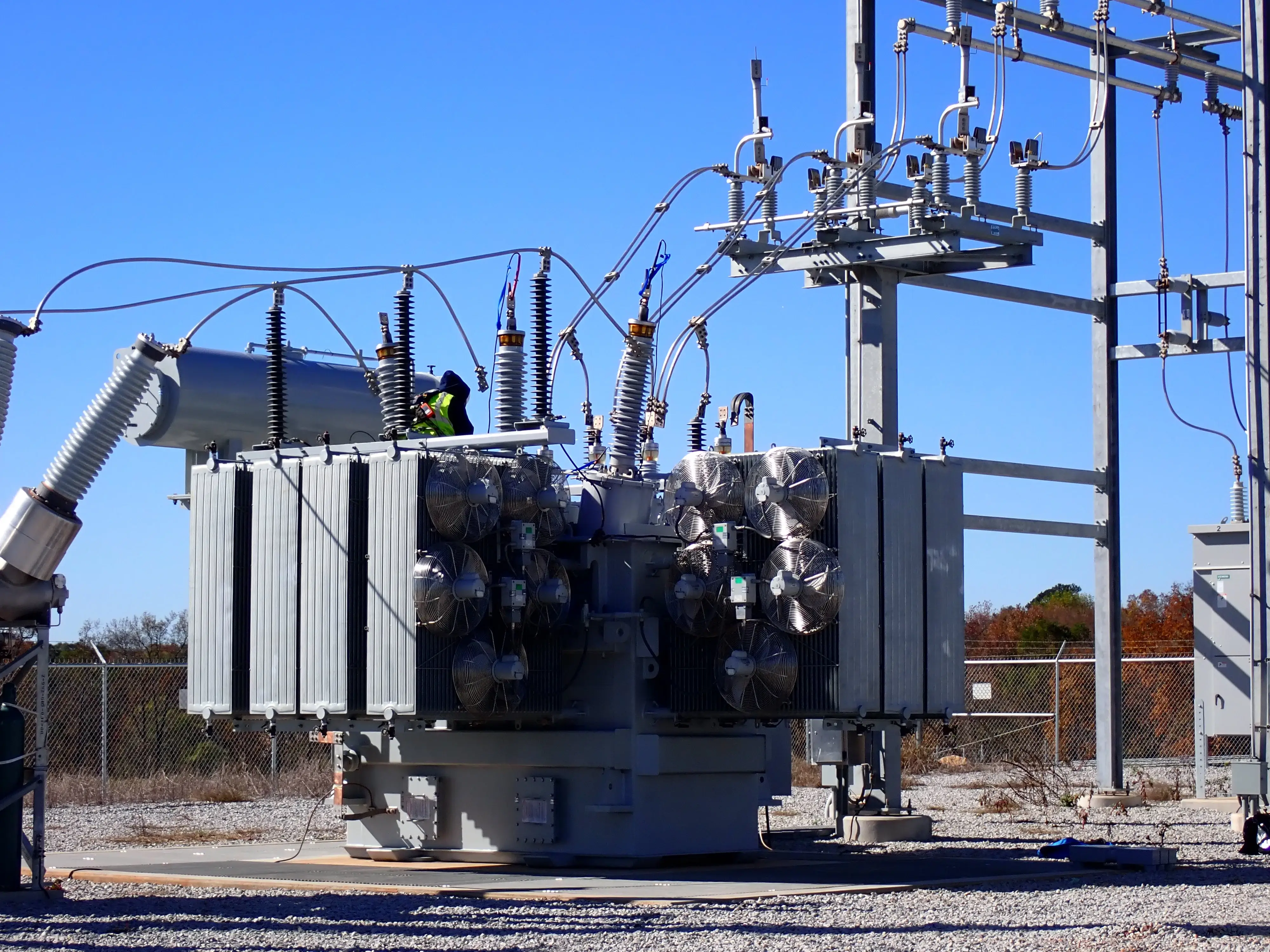 A high voltage distribution tower with connected power lines