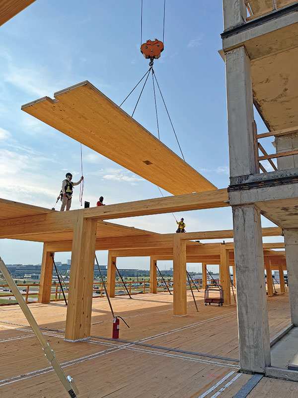 Building B at The Offices at Southstone Yards is the first mass timber office building in Dallas–Fort Worth, reducing embodied carbon through a hybrid concrete and timber structural system.