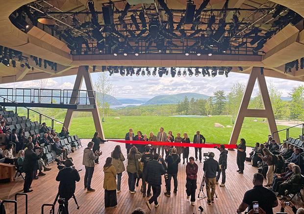 The 451-seat, open-air theater is the focal point of the company’s 98-acre arts complex and is defined by a dramatic mass-timber roof inspired by the shape of a bird’s wing. 