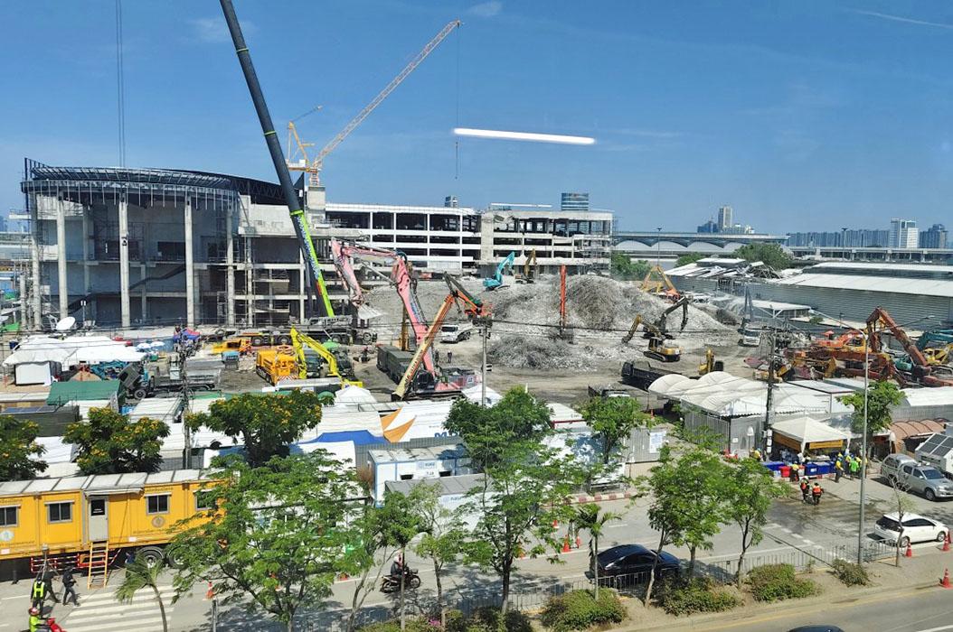 Cranes clearing steel, and reinforced concrete debris of the collapsed 30-storey new state audit building at Kamphaeng Phet 2 Road in Bangkok.