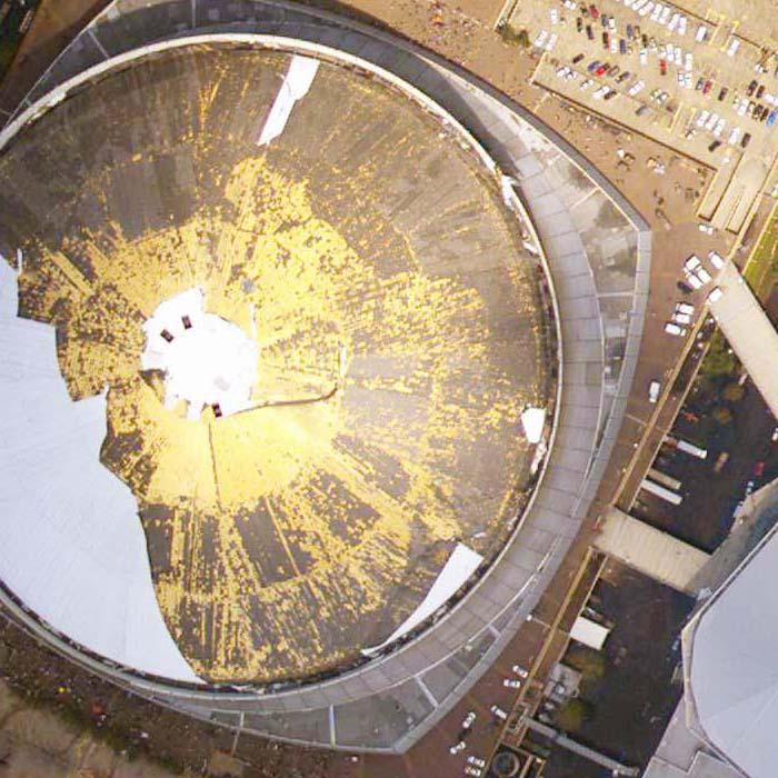 Assessing roof damage from Hurricane Katrina in New Orleans, Louisiana. 