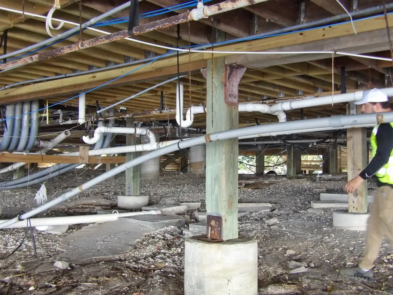 Roofs, façades, glazing, rooftop equipment, drainage systems, electrical infrastructure, elevators, and below-grade spaces are among the most vulnerable systems during a storm.