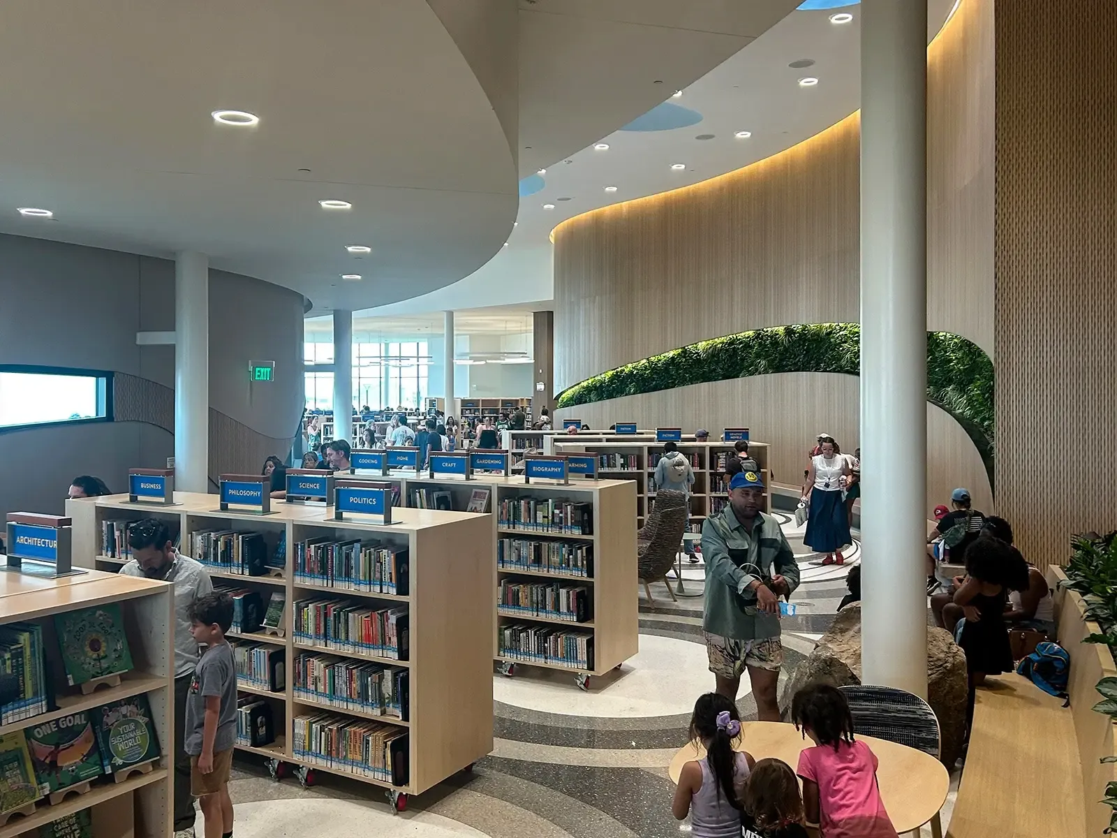 The steel-framed building has complex curving geometry – there are few square corners or straight lines – and includes a sculptural steel feature column at the entryway. 
