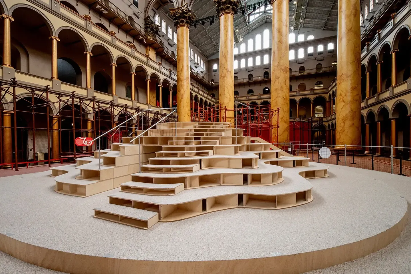 We designed a subfloor system that includes a 30-foot platform spanning the museum’s historic fountain because the historic fountain could not support additional loads and stabilized the installation without anchoring it to the ground. 